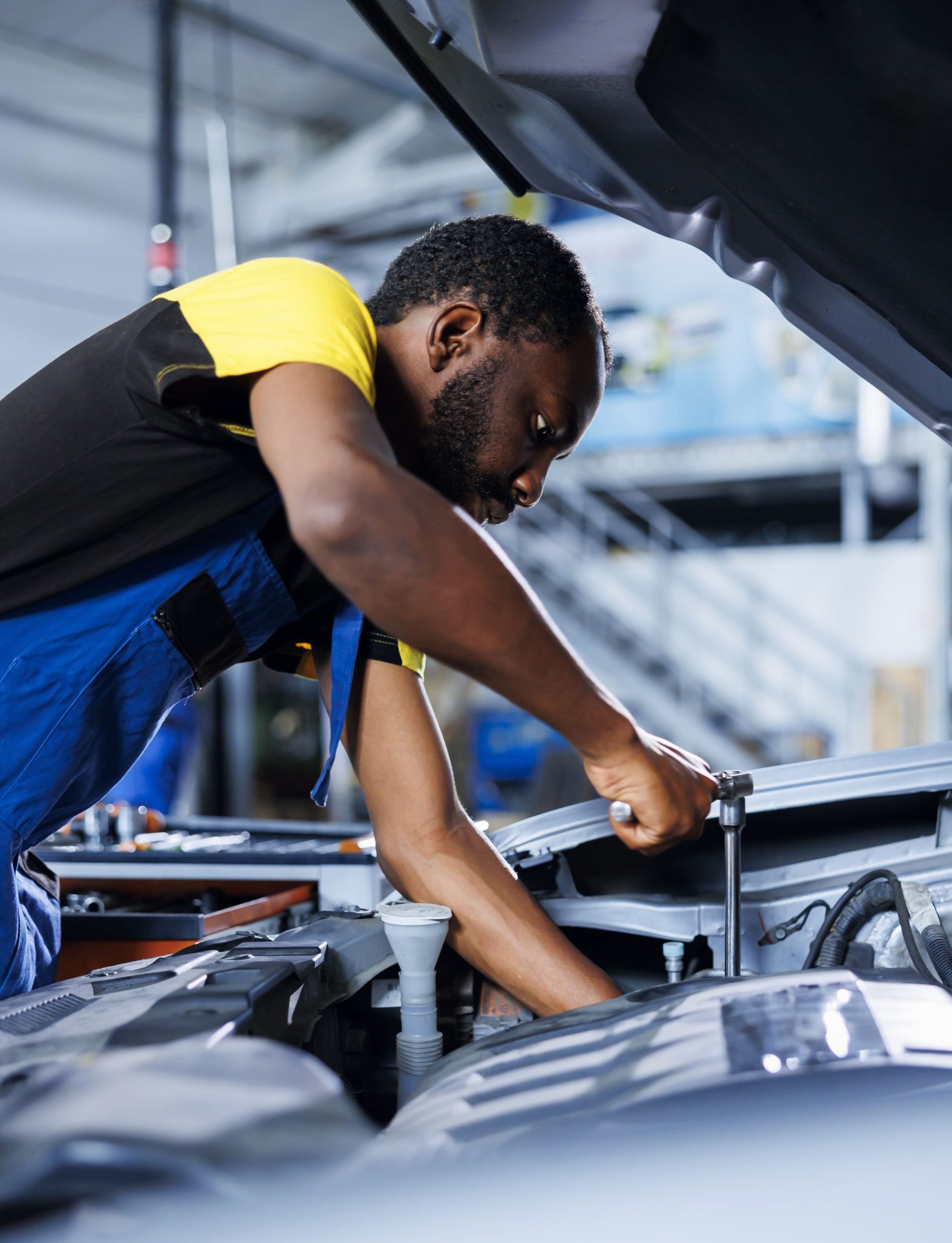 Services mechanic car service using professional mechanical tool repair broken fuel tank proficient expert garage fixing client automobile ensuring optimal automotive performance (1) (1)